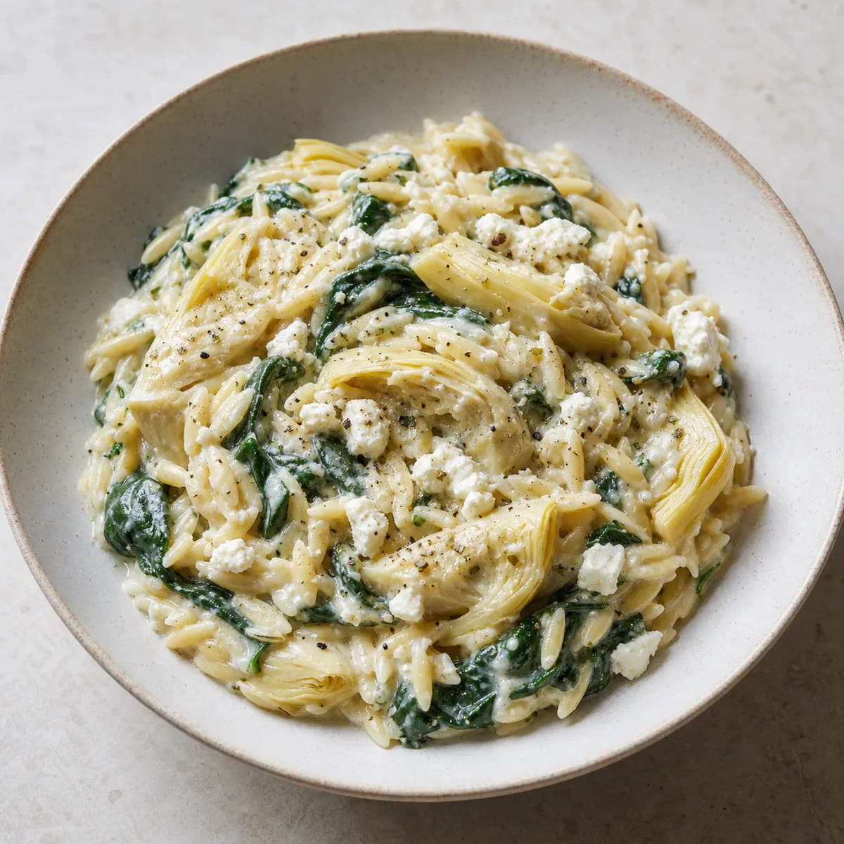 Creamy spinach artichoke orzo with feta