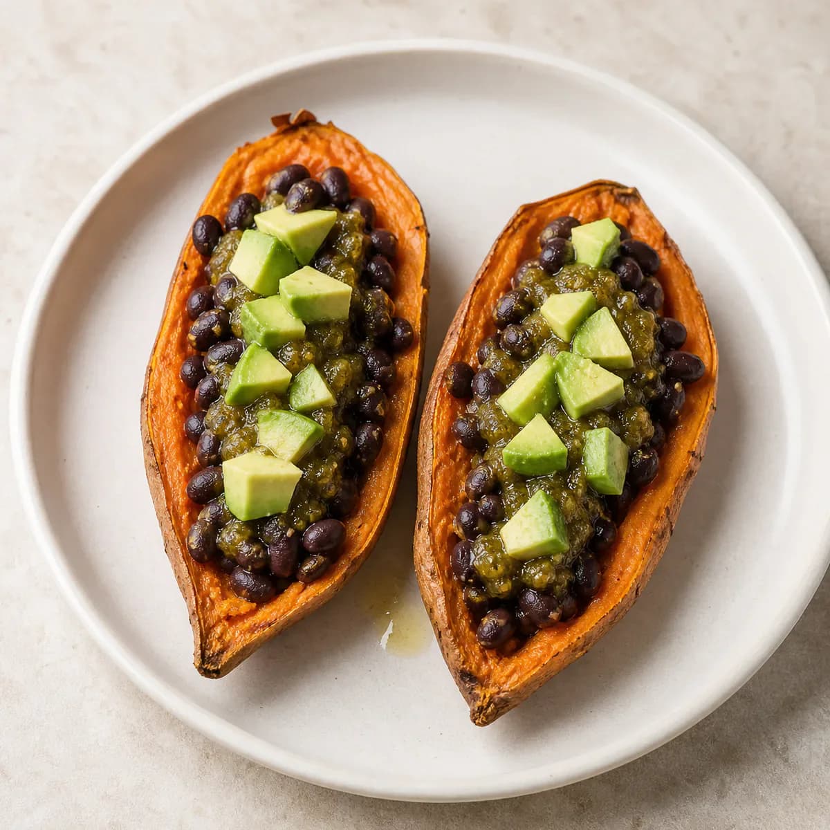 Sweet potato boats with black beans, salsa, and avocado served as one complete portion